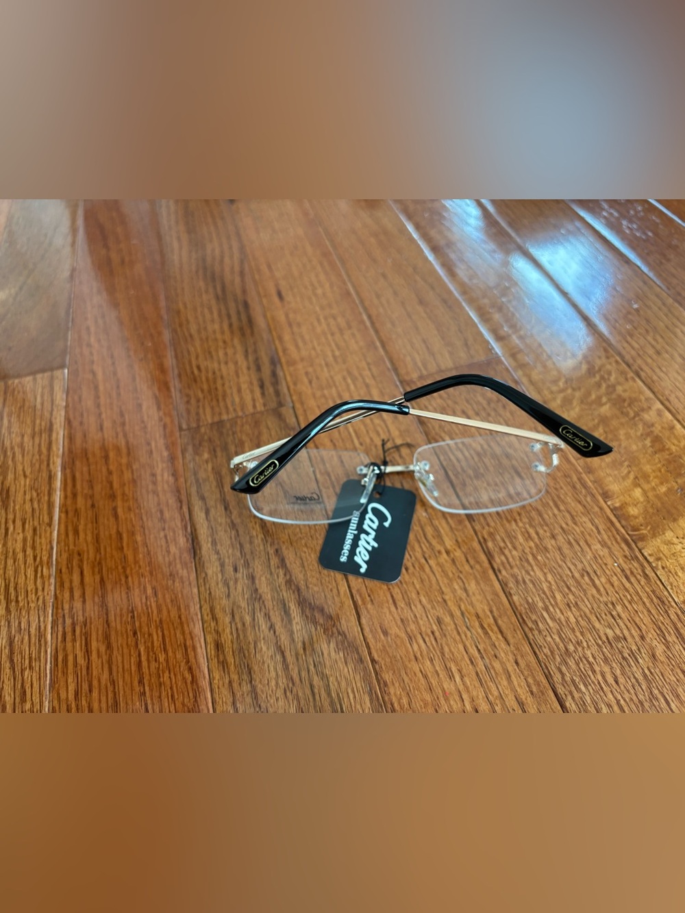 Cartier Rimless Men's Glasses with Black Temples and Gold Details